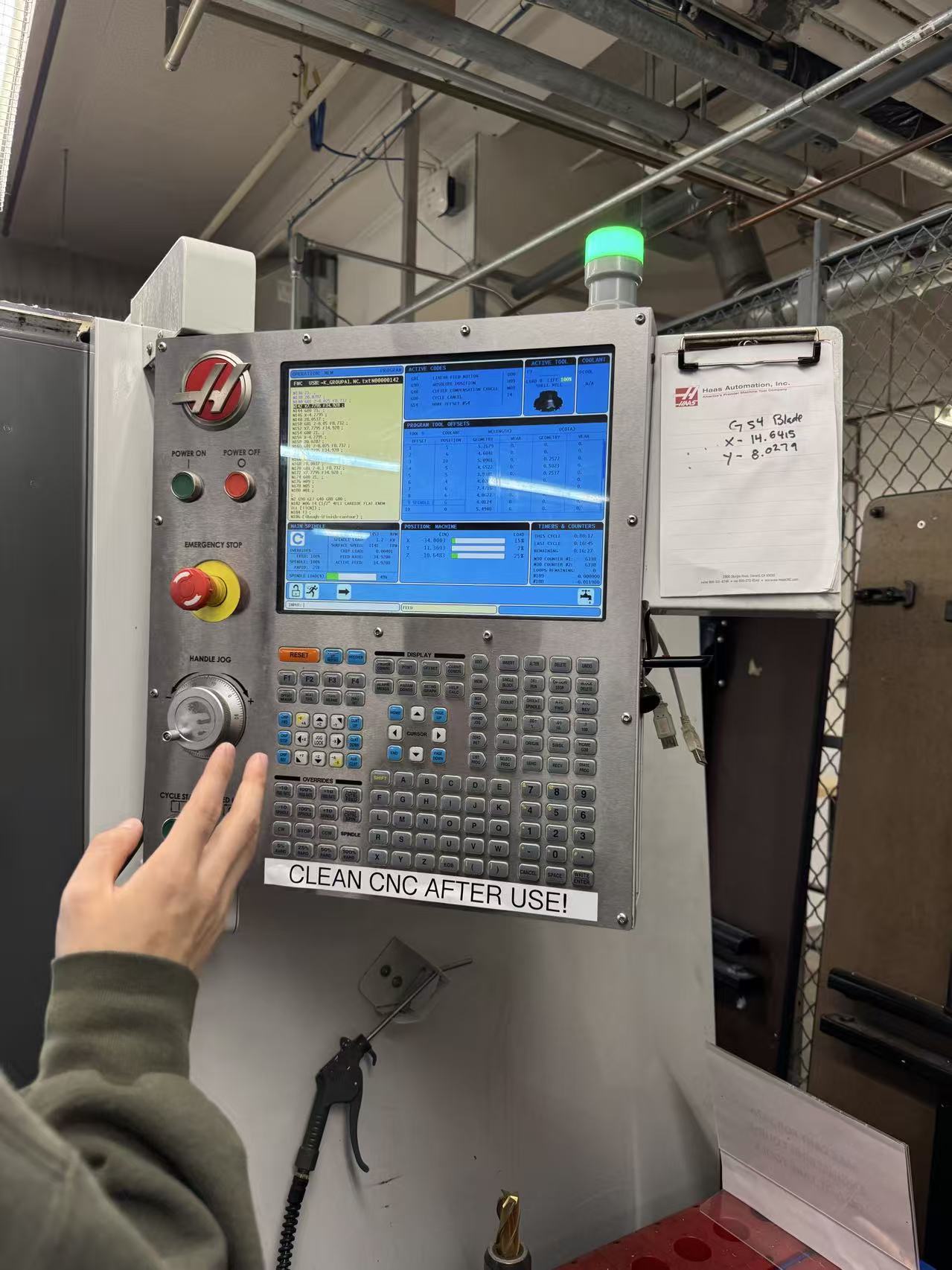 Janice Hu working at machine controls